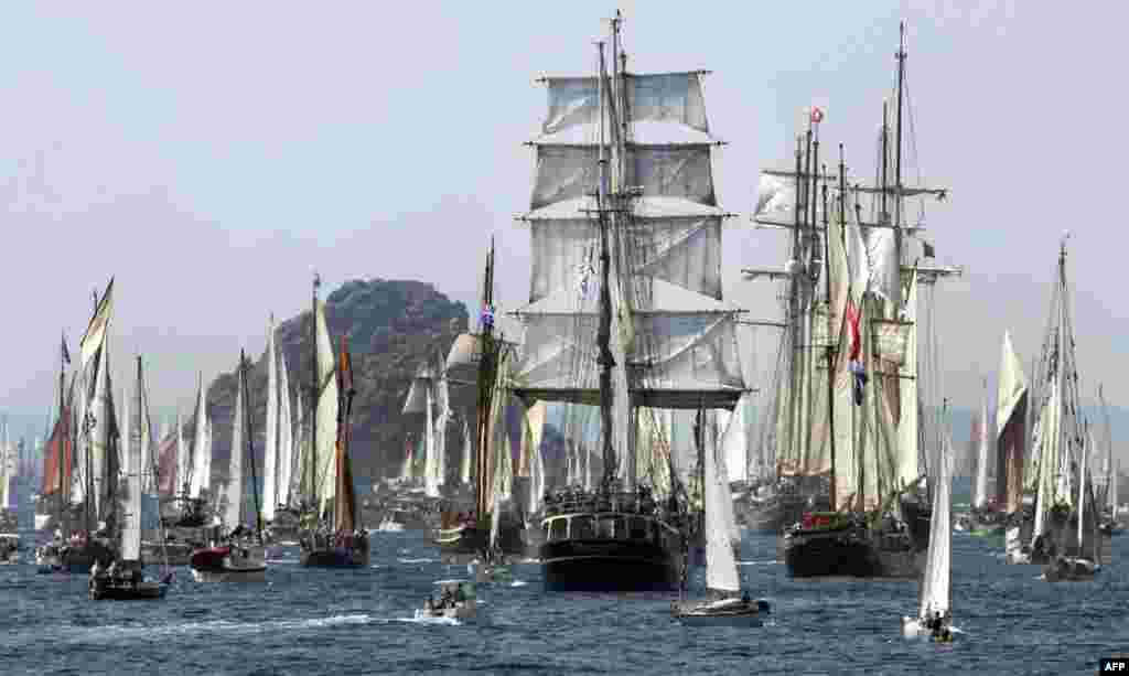 Hundreds of traditional boats sail near Camaret after leaving the port of Brest, western of France, for a parade between Brest and Douarnenez. Hundreds of sailing ships passed through the famous Tas-de-Pois passage in Britany for the main final parade of the the Brest 2016 Maritime festival.