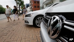 The Volkswagen emblem is seen on a vehicle in front of a dealership in Seoul, South Korea, Tuesday, Aug. 2, 2016. 