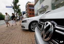The Volkswagen emblem is seen on a vehicle in front of a dealership in Seoul, South Korea, Aug. 2, 2016.