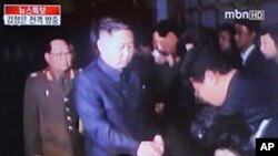 A South Korean man watches a TV newscast reporting the visit to China by North Korea's Kim Jong Un, at a railway station in Seoul, May 20, 2011