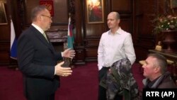 U.K. -- Russian Ambassador to the U.K. Aleksandr Yakovenko, left, meets with Novichok poisoning victim Charlie Rowley, center, and his brother Matthew, right, inside the Russian Embassy in London, April 6, 2019