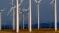 FILE - A wind turbine farm owned by PacifiCorp near Glenrock, Wyoming, produces electricity, May 6, 2013.