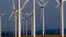 FILE - A wind turbine farm owned by PacifiCorp near Glenrock, Wyoming, cranks out electricity, May 6, 2013.