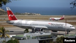 A plane from Russian company Nordwind is seen at Simon Bolivar Airport in Caracas, Venezuela, Jan. 29, 2019. 