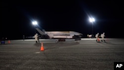 The Air Force’s X-37B successfully lands at NASA’s Kennedy Space Center Shuttle Landing Facility on Merritt Island in Brevard County, Fla., following a record-breaking two-year mission, in this Oct. 27, 2019, photo released by the U.S. Air Force.