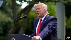 President Donald Trump speaks before signing an executive order on the "White House Hispanic Prosperity Initiative," in the Rose Garden of the White House, Thursday, July 9, 2020, in Washington. (AP Photo/Evan Vucci)