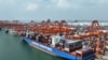 FILE - In this photo released by Xinhua News Agency, aerial photo shows a container ship berthed at the container wharf of Qinzhou Port in Qinzhou in southern China's Guangxi Zhuang Autonomous Region on Sept. 13, 2022. (Zhang Ailin/Xinhua via AP)