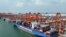 FILE - In this photo released by Xinhua News Agency, aerial photo shows a container ship berthed at the container wharf of Qinzhou Port in Qinzhou in southern China's Guangxi Zhuang Autonomous Region on Sept. 13, 2022. (Zhang Ailin/Xinhua via AP)