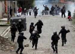 Supporters of former President Evo Morales clash with police in La Paz, Bolivia.
