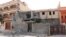 Damage to a house is seen following clashes between rival militias in the Janzour district on the outskirts of Tripoli, August 5, 2014. 