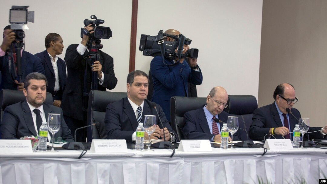 (L-R) Representatives of the Venezuelan opposition Eudoro Gonzalez, Luis Florido, Vicente Diaz and Julio Borges are pictured during their meeting with Venezuelan government's representatives at the Dominican Ministry of Foreign Affairs in Santo Domingo on Dec.15, 2017.