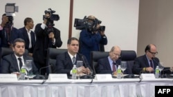 (L-R) Representatives of the Venezuelan opposition Eudoro Gonzalez, Luis Florido, Vicente Diaz and Julio Borges are pictured during their meeting with Venezuelan government's representatives at the Dominican Ministry of Foreign Affairs in Santo Domingo on Dec.15, 2017. 