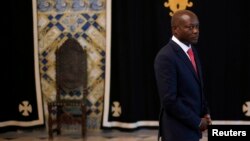 FILE - Guinea-Bissau President Jose Mario Vaz arrives to speak with journalists after a meeting with Portuguese officials at the presidential palace in Lisbon, June 19, 2014. 