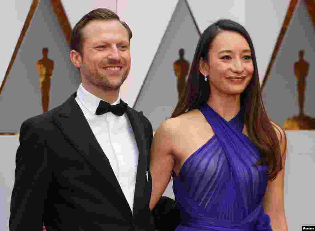 Director Orlando Von Einsiedel and producer Joanna Natasegara of documentary &quot;The White Helmets&quot; pose on the red carpet, Feb. 26, 2017.