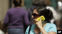 FILE - New research finds that there is no need to worry about getting cancer from holding your cellphone to your ear.