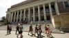 FILE - People walk past Widener Library, on the campus of Harvard University, in Cambridge, Massachusetts, July 16, 2019. Enrollment of international students is up following a drop during the pandemic, a 2022 report shows. 