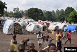 FILE - Congolese victims of ethnic violence are seen at a makeshift camp for the internally displaced people in Bunia, Ituri province in the eastern Democratic Republic of Congo, June 25, 2019.