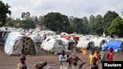 FILE - Congolese victims of ethnic violence are seen at a makeshift camp for the internally displaced people in Bunia, Ituri province in the eastern Democratic Republic of Congo, June 25, 2019. 