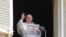 FILE - Pope Francis waves to the crowd as he arrives to recite the Angelus noon prayer from the window of his studio overlooking St.Peter's Square, at the Vatican, July 4, 2021.