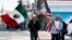 Members of the Mexican Association of Perth Amboy carry flags while taking part in an immigration protest, in Perth Amboy, New Jersey, Feb. 16, 2017.