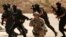 FILE - Special operations forces from Iraq, Jordan and the U.S. conduct a joint exercise.