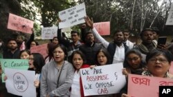 People from northeastern Indian states shout slogans against the government during a protest against Citizenship Amendment Bill (CAB), in New Delhi, India, Dec. 11, 2019. 