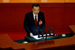 中国国务院总理李克强在2022年人大会议上作政府工作报告