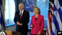 US Secretary of State Hillary Clinton (R) walks with Greek Prime Minister George Papandreou after their bilateral meeting on 8 March 2010 at the State Department in Washington DC.