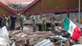 Soldiers remove debris from a partly collapsed municipal building felled by a massive earthquake in Juchitan, Oaxaca state, Mexico, Friday, Sept. 8, 2017. One of the most powerful earthquakes ever to strike Mexico has hit off its southern Pacific coast, k