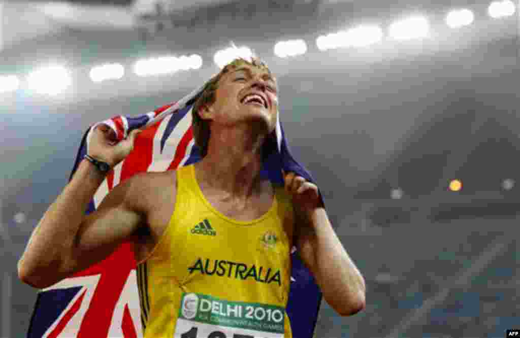 Australia's Simon Patmore celebrates after winning gold in the Men's 100m T46 final during the Commonwealth Games at the Jawaharlal Nehru Stadium in New Delhi, India, Thursday, Oct. 7, 2010. (AP Photo/Anja Niedringhaus)