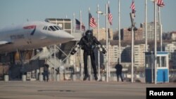 Sam Rogers, flight suit design engineer at Gravity Industries, demonstrates a Jet Suit at the Intrepid Sea, Air & Space Museum in New York, U.S., April 3, 2019.