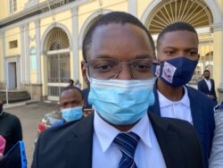 Musa Kika, who made an urgent application asking Zimbabwe Chief Justice Luke Malaba to step down, is seen speaking to journalists in Harare, May 15, 2021. (Columbus Mavhunga/VOA)