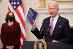 FILE - U.S. President Joe Biden speaks about his administration's plans to fight the coronavirus disease during a COVID-19 response event at the White House in Washington, Jan. 21, 2021.