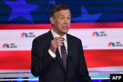 Democratic presidential hopeful former Governor of Colorado John Hickenlooper speaks during the second Democratic primary debate of the 2020 presidential campaign at the Adrienne Arsht Center for the Performing Arts in Miami, June 27, 2019.
