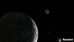 FILE - An artist's concept of the dwarf planet Eris and its moon Dysnomia is seen in this undated illustration released by NASA. The sun is the small star in the distance. (NASA/JPL-Caltech/Handout via REUTERS)