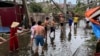 People remove fallen trees following the impact of Typhoon Yagi, in Hai Phong, Vietnam, September 8, 2024. (REUTERS/Minh Nguyen) 