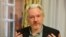 FILE - WikiLeaks founder Julian Assange gestures during a news conference at the Ecuadorian embassy in central London, August 18, 2014.