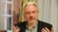 FILE - WikiLeaks founder Julian Assange gestures during a news conference at the Ecuadorian embassy in central London August 18, 2014.