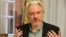 FILE - WikiLeaks founder Julian Assange gestures during a news conference at the Ecuadorian embassy in central London, Aug. 18, 2014. 