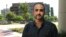 U.S. Navy veteran Mohammed Jahanfar poses for a photo during an interview on Sept. 27, 2017, in Long Beach, Calif. Jahanfar, is seeking a visa to bring his Iranian fiancée to live with him in California, and fears that may not be possible now.