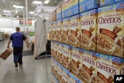 FILE - General Mills Cheerios boxes are displayed at a Sam's Club store in Rogers, Ark., June 2, 2011.