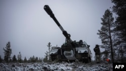 A Finnish soldier of the Karelia Brigade, one of the three Finnish Army readiness brigades, operates the K9 artillery, a 155 mm self-propelled howitzer during the NATO Exercise Dynamic Front, on November 17, 2024 near Rovaniemi, Finland.