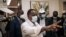 Le président congolais réélu Denis Sassou Nguesso accueille son entourage et son équipe de campagne au siège du Parti travailliste congolais, parti présidentiel à Brazzaville, le 23 mars 2021.