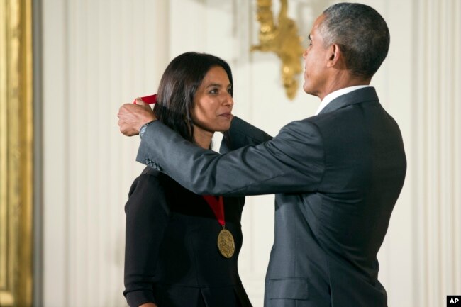 FILE - President Barack Obama awards the 2014 National Humanities Medal to author Jhumpa Lahiri of New York, during a ceremony in the East Room at the White House in Washington, Sept. 10, 2015. (AP Photo/Andrew Harnik)