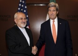 U.S. Secretary of State John Kerry (R) meets with Iran's Foreign Minister Mohammad Javad Zarif at the United Nations Headquarters in New York City, April 19, 2016.