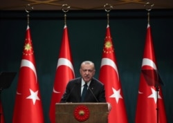 Turkey's President Recep Tayyip Erdogan speaks during a televised address following a weekly Cabinet meeting, in Ankara, Turkey, Aug. 24, 2020.