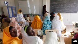 Children displaced by Boko Haram during an attack on their villages receive lectures in a camp in Maiduguri, Nigeria, Dec. 7, 2015. 