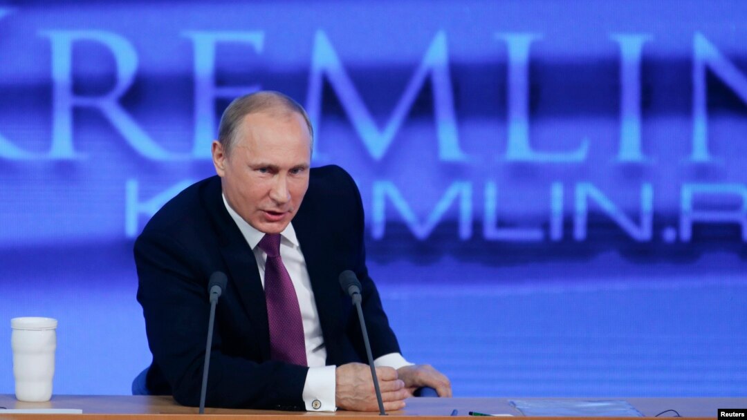FILE - Russian President Vladimir Putin speaks during his annual end-of-year news conference in Moscow, Dec. 18, 2014. Putin said on Thursday former oil tycoon Mikhail Khodorkovsky, one of his biggest critics, had the right to engage in politics "as any Russian citizen."