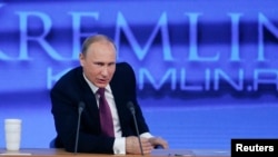 FILE - Russian President Vladimir Putin speaks during his annual end-of-year news conference in Moscow, Dec. 18, 2014. Putin said on Thursday former oil tycoon Mikhail Khodorkovsky, one of his biggest critics, had the right to engage in politics "as any Russian citizen."