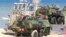 FILE - Soldiers sit atop amphibious vehicles as NATO troops participate in the NATO sea exercises BALTOPS 2015, meant to reassure the Baltic Sea region allies in the face of a resurgent Russia, in Ustka, Poland, June 17, 2015.